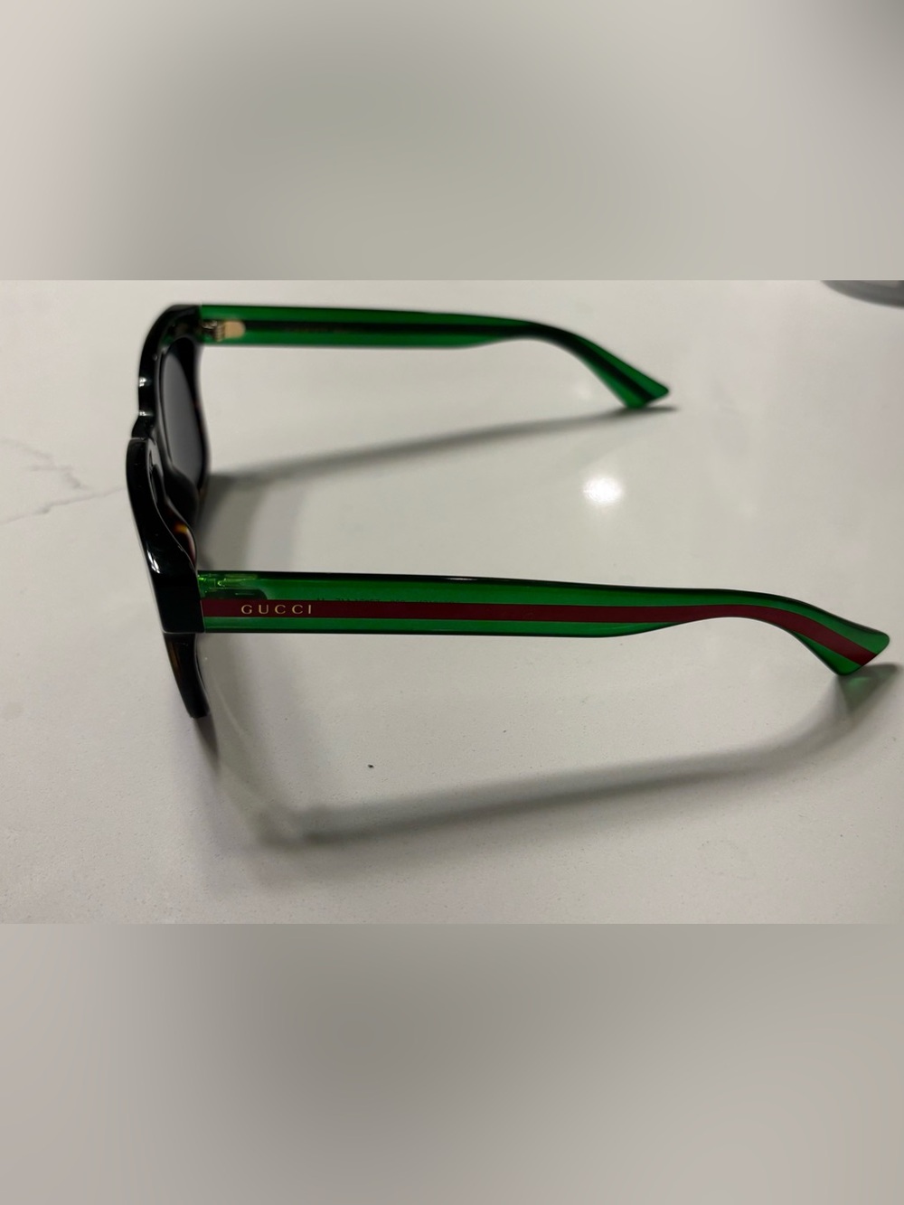 Gucci Men’s Black Sunglasses with Green and Red Striped Temples